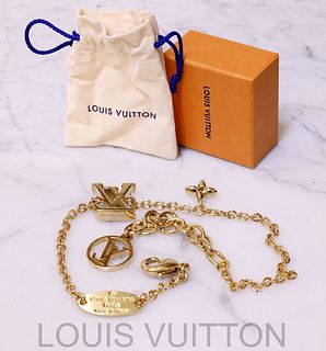A LOUIS VUITTON Jeweled LV Logo Pendant Necklace
