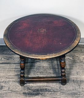VINTAGE LEATHER TOPPED ROUND COFFEE TABLE
