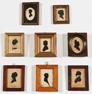 8 Antique Cutout Silhouettes Over Fabric