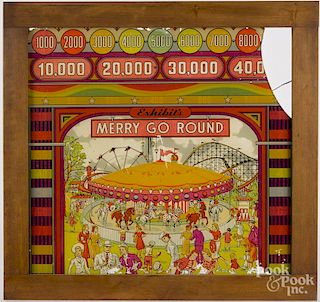 Pinball machine plate glass, 20th c., with image of Merry Go Round, 19'' x 20 1/2''.