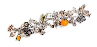 A Vintage Sterling Silver Charm Bracelet with Numerous Attached Charms, 55.60 dwts.