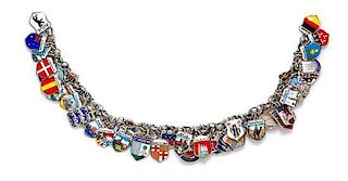 * A Silver Charm Bracelet with Numerous Attached Polychrome Enamel Travel Charms, 48.20 dwts.