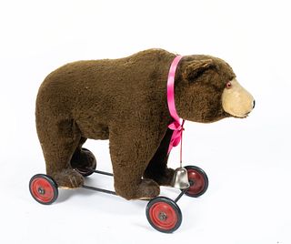 An Antique Stuffed Bear on Wheels, Possibly Steiff