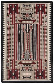 A large framed Navajo Teec Nos Pos storm pattern rug