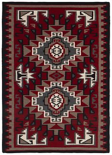 A framed Navajo Ganado rug
