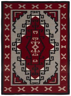 A framed Navajo Ganado rug