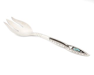 A Navajo-style silver serving spoon