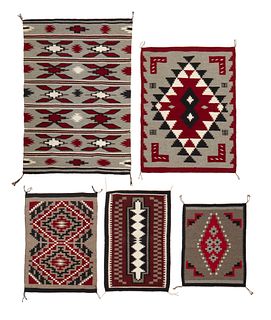 A group of small Navajo mats