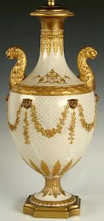 A CONTINENTAL PORCELAIN URN FASHIONED AS TABLE LAMP