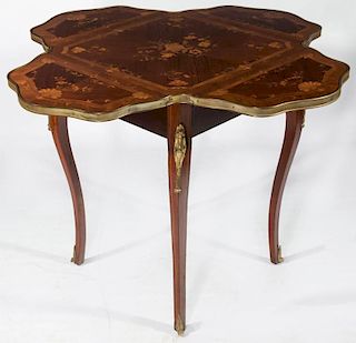 A FRENCH MARQUETRY TABLE IMPORTED BY R.J. HORNER