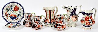 GAUDY DUTCH PORCELAIN PITCHERS CREAMERS AND PLATES