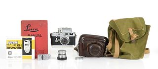 A Leica M3 Camera With Accessories