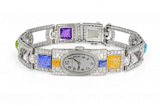 A Dreicer & Co. Art Deco Carved Colored Stone and Diamond Watch