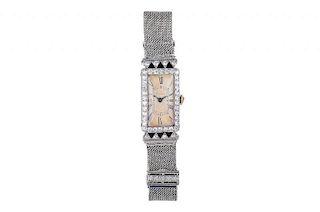 A Cartier Art Deco Platinum, Diamond and Onyx Watch