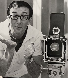 Terry O'Neill, A Simultaneous Photo - O'Neill Takes A Shot Of Comic Actor Peter Sellers, While Sellers Returns The Favour With A Linhof Camera. Rome, 