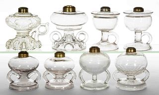 ASSORTED GLASS KEROSENE FOOTED FINGER LAMPS, LOT OF EIGHT