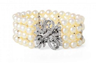 A Four Strand Cultured Pearls and Diamond Bracelet