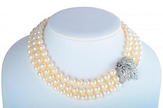 A Three Strand Pearl and Diamond Necklace