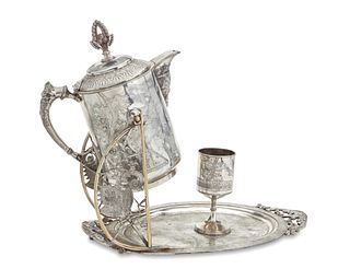 A Rogers & Bros silver-plated tipping water pitcher