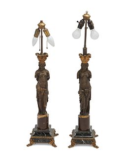 A pair of French gilt bronze caryatid lamps