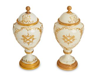 A pair of Sevres-style porcelain garniture urns
