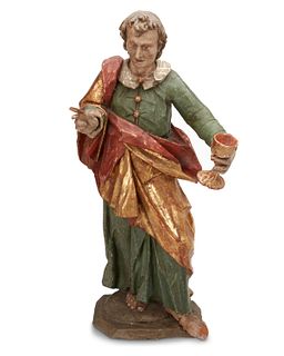 A Continental Baroque-style carved wood saint