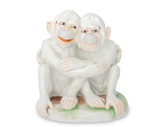 A Dresden porcelain pair of monkeys figurine