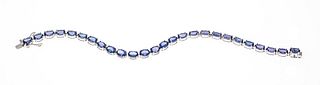 Tanzanite bracelet Harry Ivens WG 585/000 with 26 oval faceted tanzanites 6,5 x 4,5 mm lighter