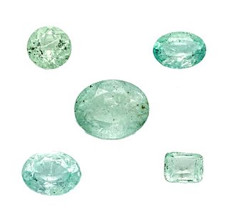5 emeralds, total 6.20 ct, 3 x oval cut, 1 x emerald cut and 1 x round faceted, slightly bluish pale
