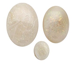 3 milk opal cabochons, total 20.95 ct, white, opaque, with light to stronger color play, 22.8 x 16.2
