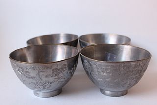 Four Chinese Engraved Tea Cups