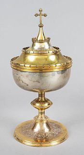 Ciborium/hostian goblet, Germany (Paderborn), 1920s, silvered and gilded (rubbed). Round, profiled and ornamented foot, shaft with nodus, multi-tiered