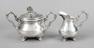 Cream and sugar bowl, German, c. 1900, silver 800/000, 1x with inner gilding, each on 4 decorated feet, bulbous body, lateral set decorated ear handle
