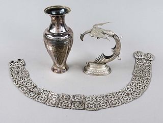 Set of three pieces, 20th c., plated, vase, h. 22,5 cm, phoenix on an oval base, h. 17 cm and belt, l. 85 cm