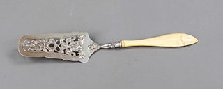 Cake server, Austria, 1849, silver 13 soldered (812,5/000), curved lifter, openwork with floral relief decor, leg handle, l. 33 cm, gross weight ca. 7
