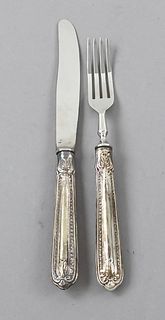Fruit set for twelve persons, 20th century, plated, filled handles with ornamental relief decor, 12 forks and knives each, l. to 18,5 cm