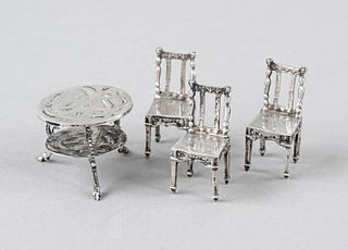 Miniature set of seats, 20th c., silver 800/000 or tested, oval table with 3 chairs, h. to 5 cm, total weight ca. 82 g