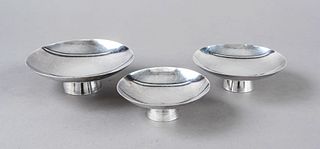 Three saké bowls, Japan, 20th century, silver hallmarked, on round stand, shallow round bowl, character engraving, Ø 10,5 - 13,5 cm, ca. 397 g