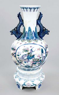 Vase on pedestal, probably Japan circa 1900, bulbous porcelain trumpet vase with applied dragon handles and polychrome underglaze painting of dragons,