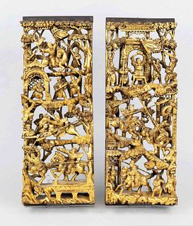 Pair of wooden panels, China, 20th century, wood carvings with elaborate openwork, colored in red and gold, various heroic scenes, each 48x19cm
