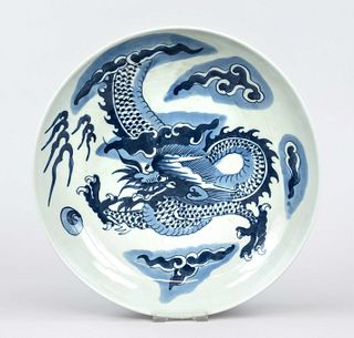 Dragon plate, Qing dynasty(1644-1911), probably 17th century or later, porcelain plate with cobalt blue decoration of a dragon energetically emerging 