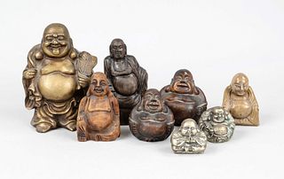 8 bald bellied buddhas with nasty look, China et al., 20th c., various materials and sizes, budai with the treasure bag in various formulations, h up 