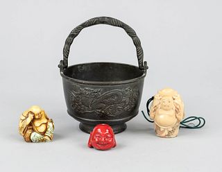 3 fat sack buddhas in handle pot, China, 20th c., metal cast dragon pot contains 2 netsuke budai and a coral budai head, h to 8cm