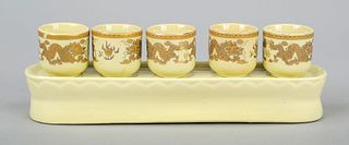 Five dragon brandy cups, probably Jingdezhen c. 1900, porcelain with soft yellow glaze background and dragon painting in gold color, on porcelain plat