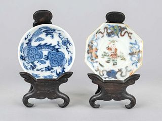 2 Miniature plates, China, 19th c., porcelain with polychrome glaze decoration, depicting children and dragon decoration, each on wooden stand, probab