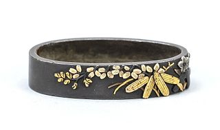 Fuchi, Japan, Edo period, 18th/19th century, relief on smooth ground, details in silver, gold and copper; autumn grasses motif