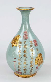 Seladon vase, China, 20th c., porcelain bottle vase with craquelé celadon glaze and golden leaves along with inscription poem, at the bottom 5 fire su