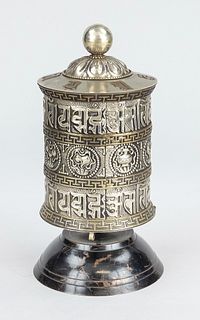 Prayer mill, Nepal, 19th/20th c., white metal in repoussé drift work with brass decoration, the 8 Buddhist symbols of happiness(skrt. ashtamangala) in