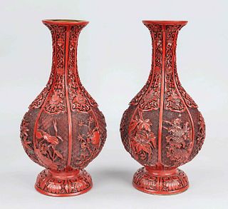 Pair of red lacquer vases, China, 19th/20th century, brass body in gourd form with red lacquer engraved tendril play and blooming flowers of the seaso