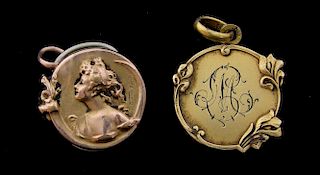 Art Nouveau medallion pendants, one with portrait of a lady and Irises' after Emile Dropsy, 2.8 cm, signed, mark for gold pla